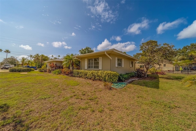 501 Poinsettia Rd, Belleair, FL 33756 - view of side of home featuring stucco siding