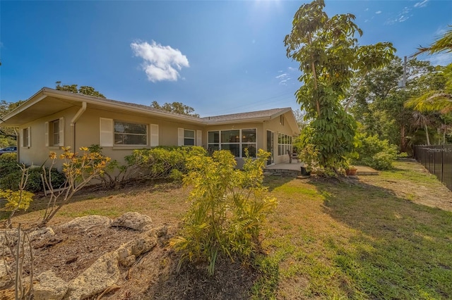 501 Poinsettia Rd, Belleair, FL 33756 - rear view of house with stucco siding and a patio