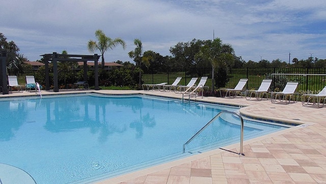 4444 Aqua Mirage St, Sarasota, FL 34238 - community pool featuring a patio area and a pergola