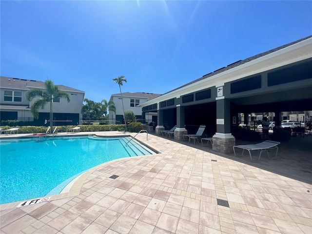 4444 Aqua Mirage St, Sarasota, FL 34238 - community pool featuring a patio