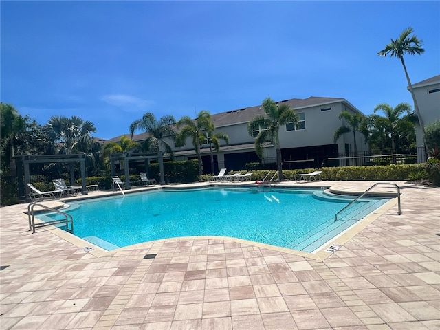 4444 Aqua Mirage St, Sarasota, FL 34238 - community pool featuring a pergola and a patio