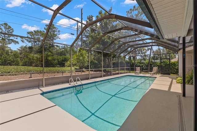 3133 Harvest Moon Dr, Palm Harbor, FL 34683 - swimming pool with a patio area and glass enclosure