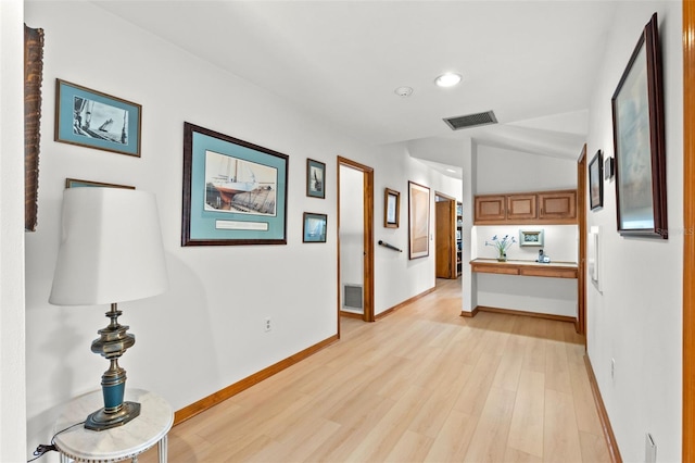 3133 Harvest Moon Dr, Palm Harbor, FL 34683 - hallway with light wood-style flooring and recessed lighting
