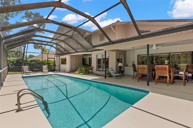 3133 Harvest Moon Dr, Palm Harbor, FL 34683 - outdoor pool with a ceiling fan, a patio, and a lanai