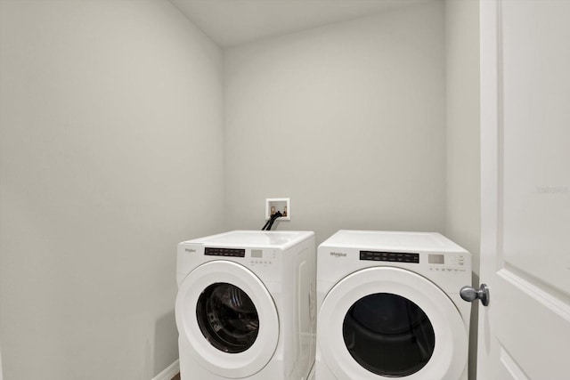 3146 Forrest Plum Ct, Zephyrhills, FL 33540 - washroom with washing machine and dryer and baseboards