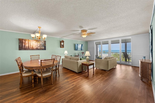 1581 Gulf Blvd Unit 403N, Clearwater Beach, FL 33767 - dining area featuring a textured ceiling, a chandelier, dark wood-type flooring, ceiling fan, and baseboards