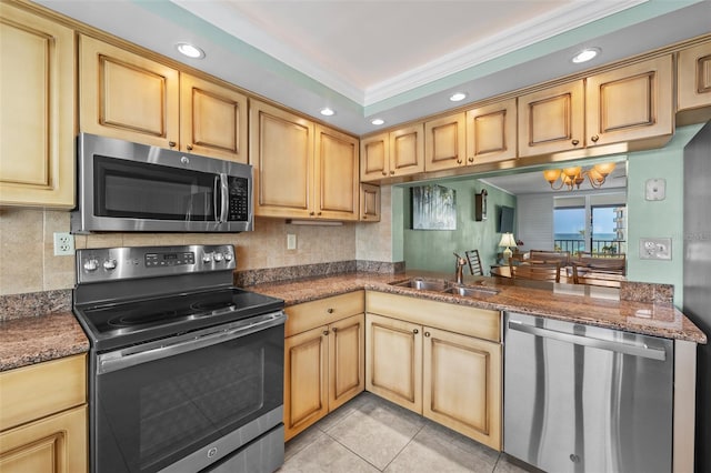 1581 Gulf Blvd Unit 403N, Clearwater Beach, FL 33767 - kitchen with stainless steel appliances, a sink, a chandelier, recessed lighting, and decorative backsplash