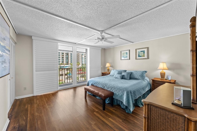 1581 Gulf Blvd Unit 403N, Clearwater Beach, FL 33767 - bedroom featuring wood finished floors, access to outside, a ceiling fan, baseboards, and a textured ceiling