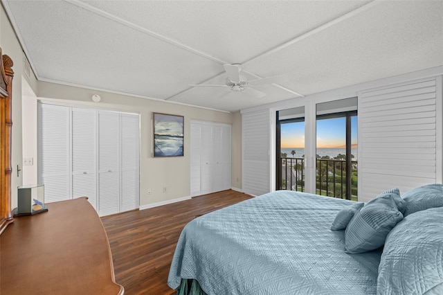 1581 Gulf Blvd Unit 403N, Clearwater Beach, FL 33767 - bedroom featuring access to exterior, wood finished floors, baseboards, two closets, and ceiling fan