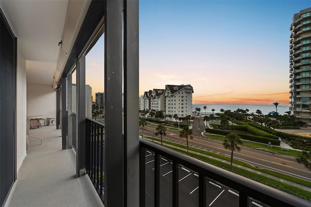 1581 Gulf Blvd Unit 403N, Clearwater Beach, FL 33767 - balcony at dusk with a water view and a view of city