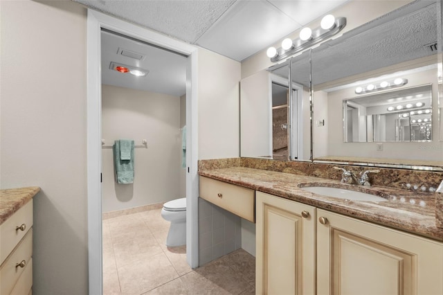1581 Gulf Blvd Unit 403N, Clearwater Beach, FL 33767 - bathroom featuring vanity, toilet, and tile patterned floors