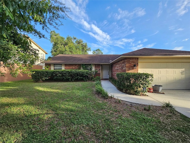 1011 Mallow Way, Brandon, FL 33510 - single story home featuring brick siding, a garage, a front yard, and driveway