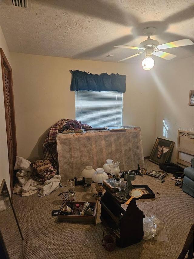 1011 Mallow Way, Brandon, FL 33510 - living room with carpet, a textured ceiling, and a ceiling fan