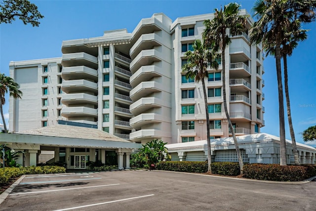 1 Seaside Ln Unit 302, Belleair, FL 33756 - view of apartment building / complex with uncovered parking