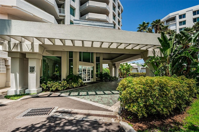 1 Seaside Ln Unit 302, Belleair, FL 33756 - entrance to property featuring stucco siding and french doors
