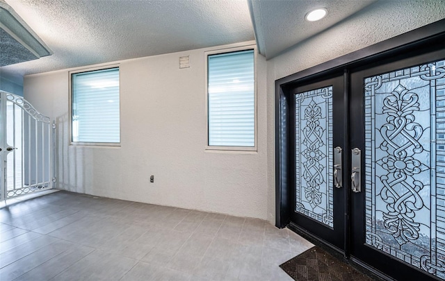 1 Seaside Ln Unit 302, Belleair, FL 33756 - foyer entrance with a textured ceiling and a textured wall