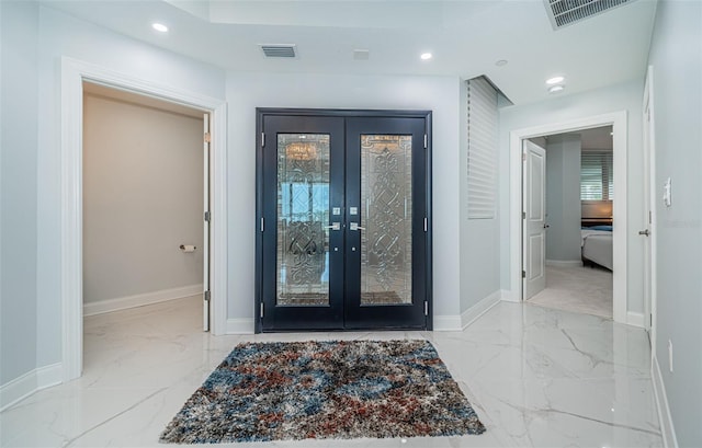 1 Seaside Ln Unit 302, Belleair, FL 33756 - entryway featuring marble look tiles, french doors, and recessed lighting