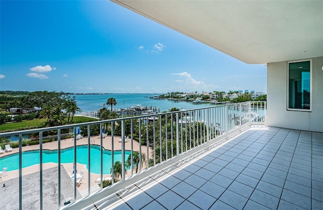1 Seaside Ln Unit 302, Belleair, FL 33756 - balcony with a water view and view of pool area