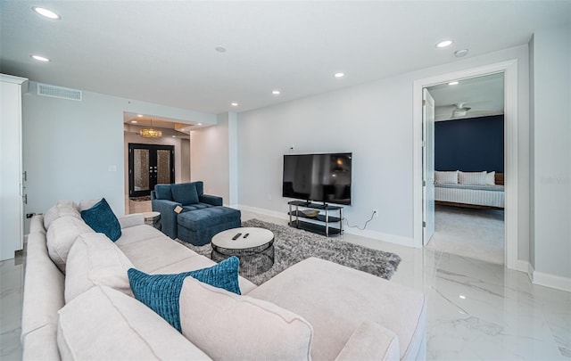 1 Seaside Ln Unit 302, Belleair, FL 33756 - living area featuring recessed lighting, light marble finish floors, and radiator heating unit