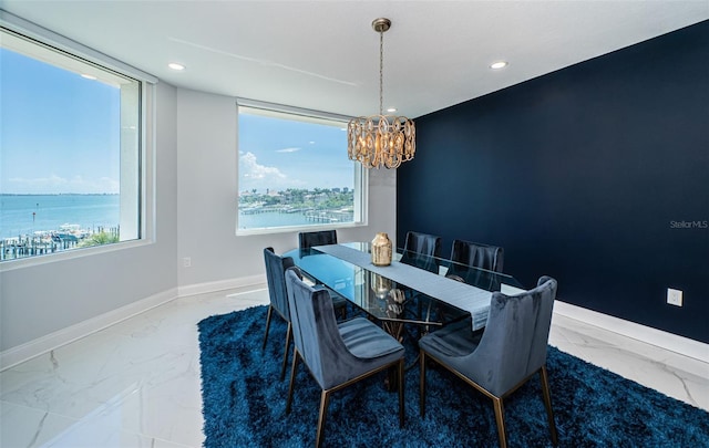 1 Seaside Ln Unit 302, Belleair, FL 33756 - dining room with marble finish flooring, a chandelier, healthy amount of natural light, recessed lighting, and a water view