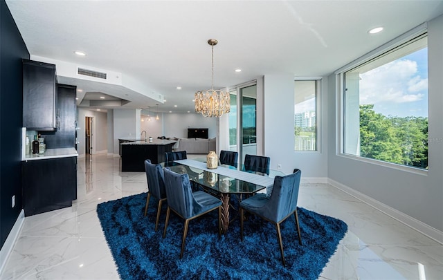 1 Seaside Ln Unit 302, Belleair, FL 33756 - dining space with light marble finish floors, a chandelier, and recessed lighting