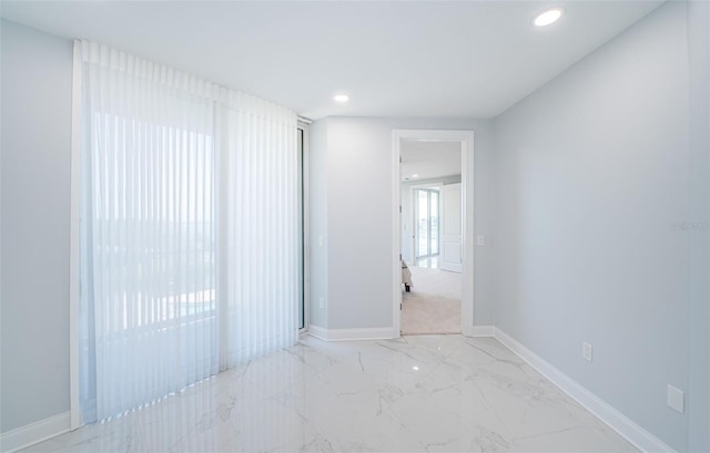 1 Seaside Ln Unit 302, Belleair, FL 33756 - empty room featuring light marble finish floors and recessed lighting