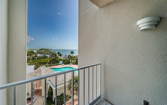 1 Seaside Ln Unit 302, Belleair, FL 33756 - balcony featuring a water view and view of pool area
