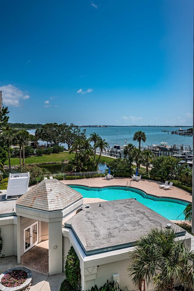 1 Seaside Ln Unit 302, Belleair, FL 33756 - community pool featuring a patio and a water view