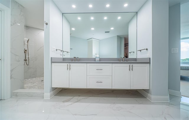 1 Seaside Ln Unit 302, Belleair, FL 33756 - bathroom with marble tiled flooring, recessed lighting, a marble finish shower, and double vanity