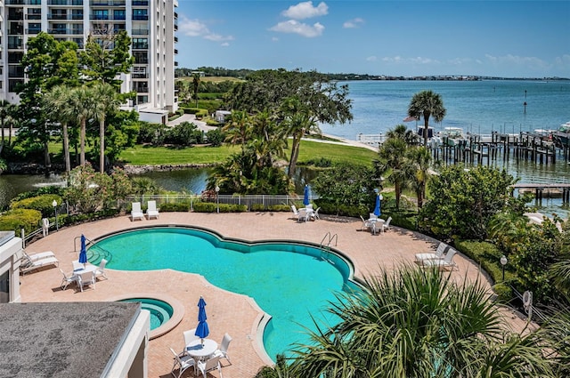 1 Seaside Ln Unit 302, Belleair, FL 33756 - community pool featuring a patio area and a water view