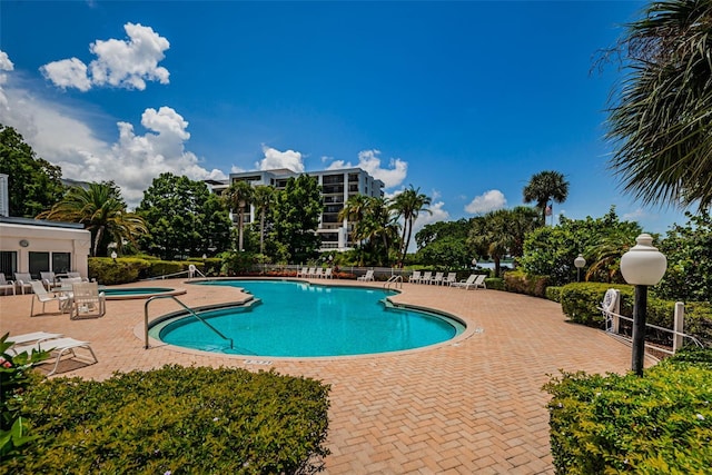 1 Seaside Ln Unit 302, Belleair, FL 33756 - community pool featuring a patio area and a hot tub