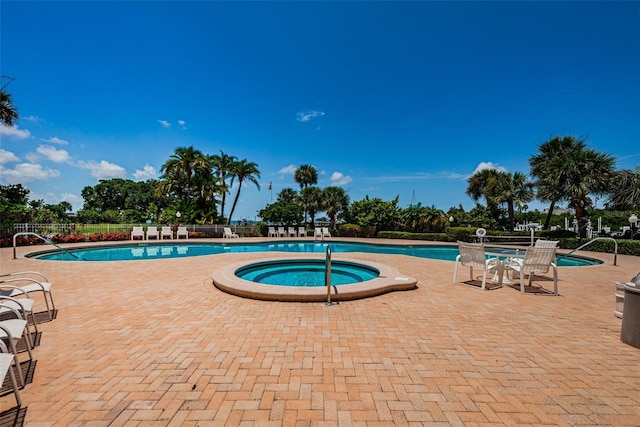 1 Seaside Ln Unit 302, Belleair, FL 33756 - community pool with a hot tub and a patio area