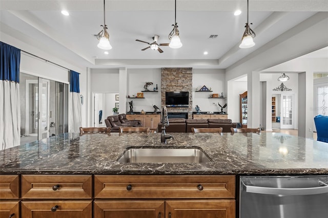 33219 Kateland Dr, Wesley Chapel, FL 33545 - kitchen featuring stainless steel dishwasher, open floor plan, a sink, a ceiling fan, and recessed lighting