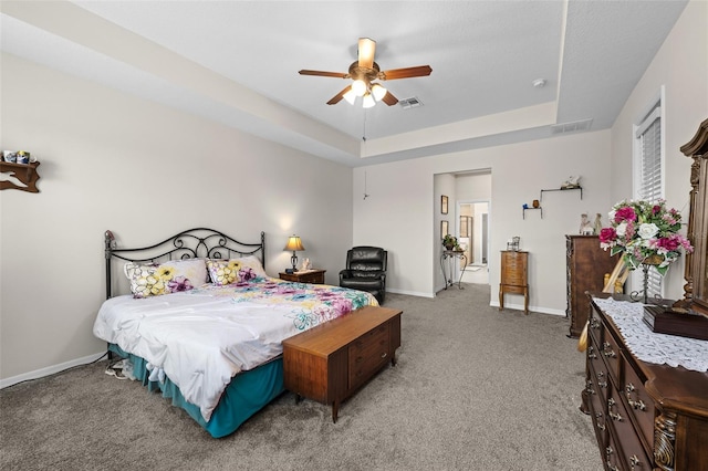 33219 Kateland Dr, Wesley Chapel, FL 33545 - bedroom with carpet, a tray ceiling, baseboards, and ceiling fan