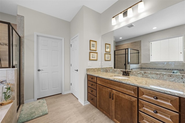 33219 Kateland Dr, Wesley Chapel, FL 33545 - bathroom with a stall shower, vanity, and baseboards