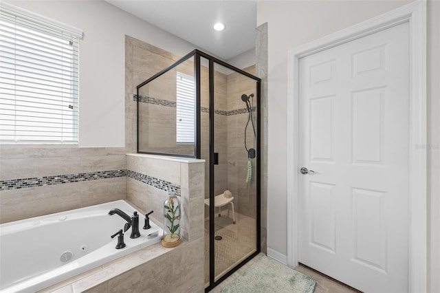 33219 Kateland Dr, Wesley Chapel, FL 33545 - full bath featuring a jetted tub and a shower stall