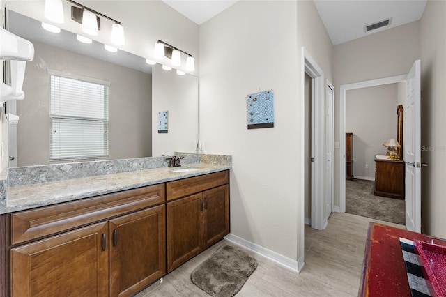 33219 Kateland Dr, Wesley Chapel, FL 33545 - bathroom with vanity and baseboards