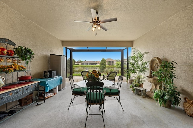 33219 Kateland Dr, Wesley Chapel, FL 33545 - view of patio / terrace featuring outdoor dining area, a ceiling fan, and a lanai