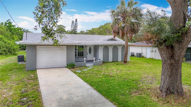 8329 Gulf Way, Hudson, FL 34667 - ranch-style home with stucco siding, cooling unit, an attached garage, and a front yard