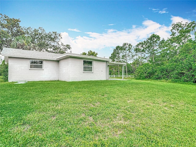 8329 Gulf Way, Hudson, FL 34667 - view of side of home with a yard
