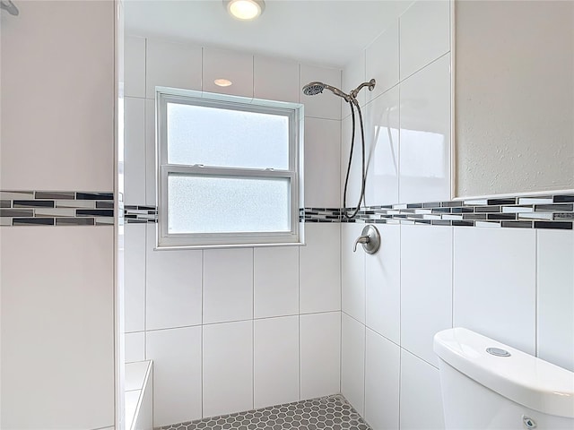 8329 Gulf Way, Hudson, FL 34667 - full bath featuring a tile shower, toilet, and tile walls