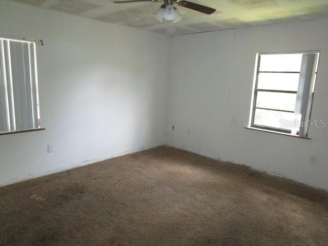 5190 Starling Dr, Mulberry, FL 33860 - carpeted spare room with a ceiling fan