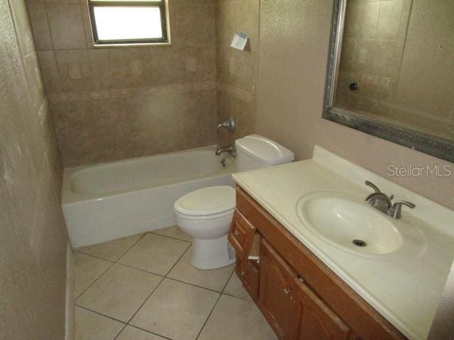5190 Starling Dr, Mulberry, FL 33860 - bathroom with tile patterned floors, vanity, and shower / bathtub combination