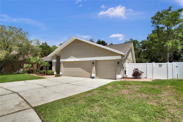 12219 Steppingstone Blvd, Tampa, FL 33635 - view of side of home featuring an attached garage, concrete driveway, and brick siding