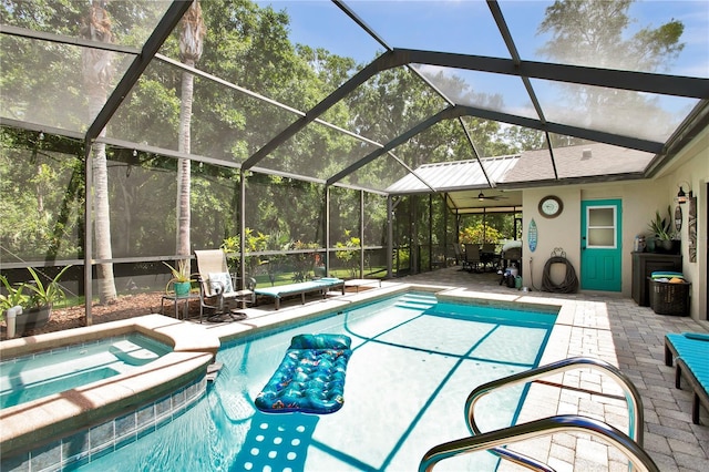 12219 Steppingstone Blvd, Tampa, FL 33635 - view of swimming pool featuring a patio area, ceiling fan, a pool with connected hot tub, and glass enclosure