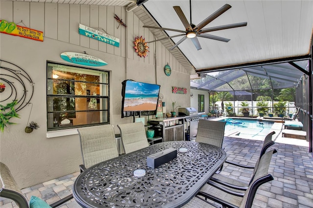 12219 Steppingstone Blvd, Tampa, FL 33635 - view of patio / terrace with outdoor dining area, a ceiling fan, an outdoor pool, and a lanai
