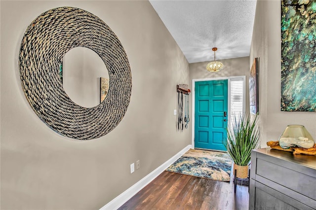 12219 Steppingstone Blvd, Tampa, FL 33635 - foyer entrance with baseboards, wood finished floors, and a textured ceiling