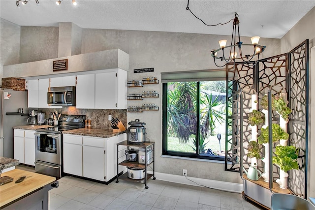 12219 Steppingstone Blvd, Tampa, FL 33635 - kitchen featuring stainless steel appliances, a chandelier, backsplash, white cabinets, and a textured ceiling