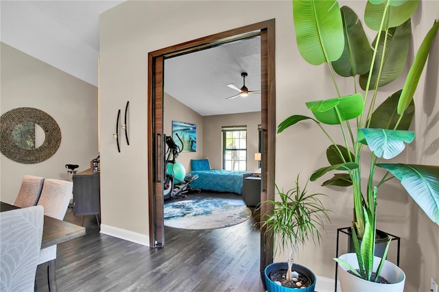 12219 Steppingstone Blvd, Tampa, FL 33635 - corridor featuring wood finished floors, vaulted ceiling, and baseboards