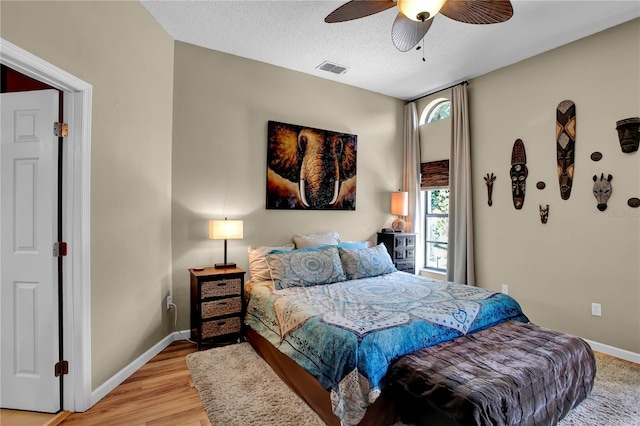 12219 Steppingstone Blvd, Tampa, FL 33635 - bedroom featuring baseboards, wood finished floors, and a ceiling fan